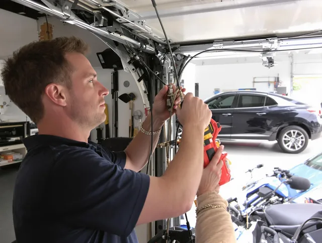 Gardena Garage Door Repair safety certified technician performing cable replacement in Gardena