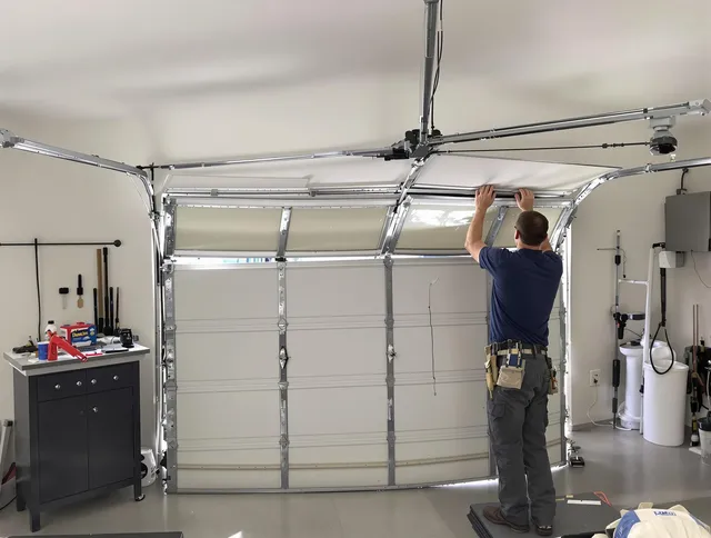 Gardena Garage Door Repair specialist performing precise section replacement on Gardena garage door